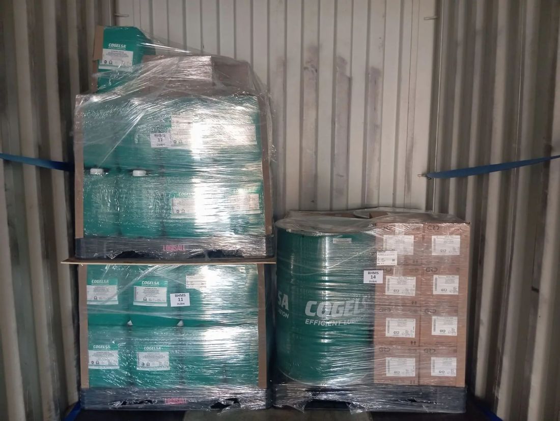 COGELSA boxes and drums with BHMS Dubai pallet labels inside a container