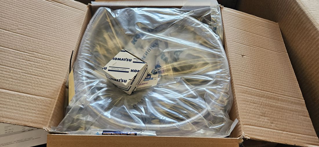 Genuine Komatsu ring gear in original packaging with Komatsu Genuine Parts label