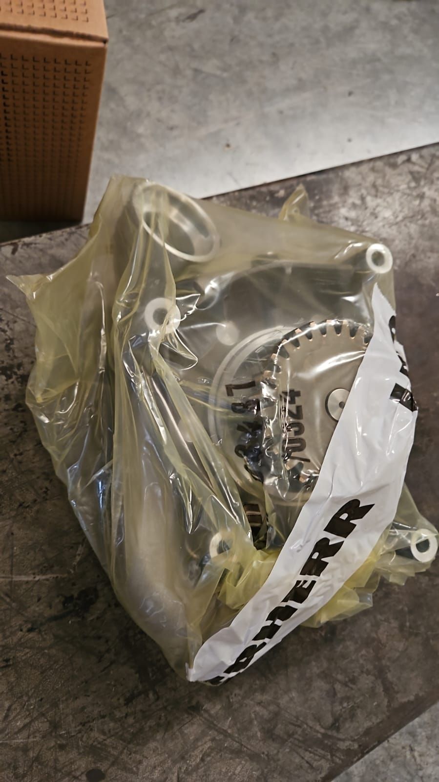 Genuine Liebherr pump in VCI protective packaging with Liebherr tape